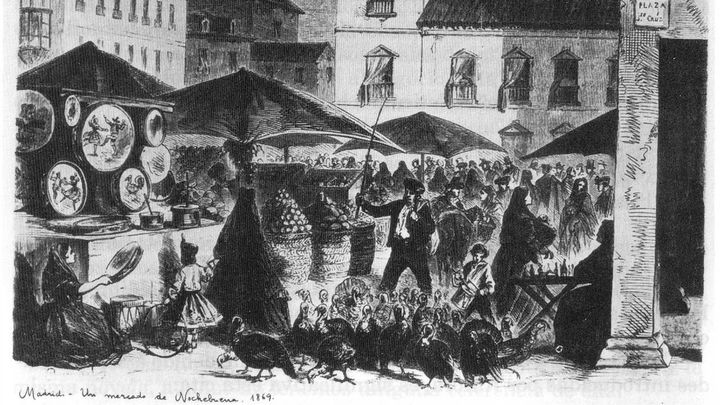 Grabado-ilustración del mercado navideño instalado en las inmediaciones de la Plaza de la Santa Cruz de Madrid hacia 1869. / Anónimo
