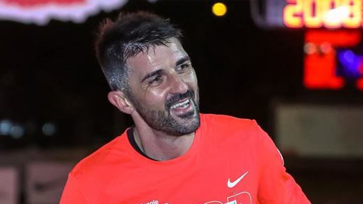 El exfutbolista David Villa participa en la San Silvestre Vallecana / EFE