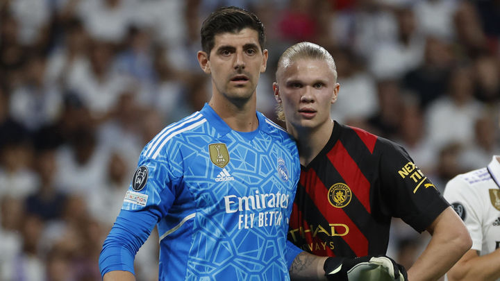 Courtois y Haaland / EFE